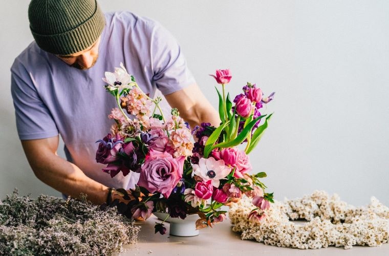 Natural flower arrangement with roses anemones and tulips
